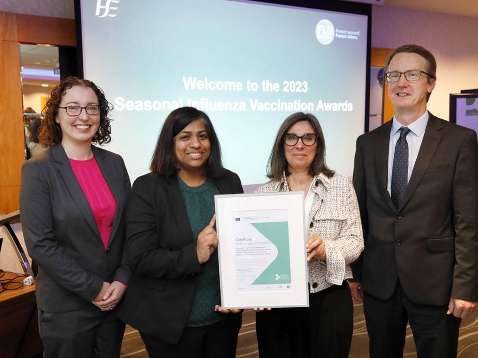 Award ceremony at the Dublin onsite visit. Speakers showcasing a certificate. 